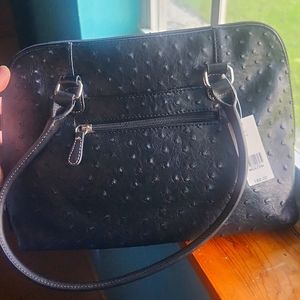 Kim Roger's black purse